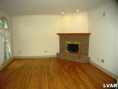 532 Roberts Road Nazareth, PA 18064 - Photo 14 of 34 a view of an empty room with wooden floor and a fireplace