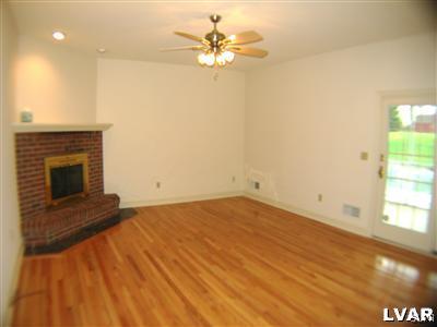 532 Roberts Road Nazareth, PA 18064 - Photo 15 of 34 wooden floor in an empty room with a fireplace