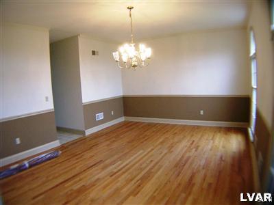 532 Roberts Road Nazareth, PA 18064 - Photo 17 of 34 a view of a room with wooden floor and chandelier