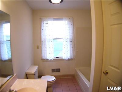 532 Roberts Road Nazareth, PA 18064 - Photo 25 of 34 a bathroom with a toilet sink and a window
