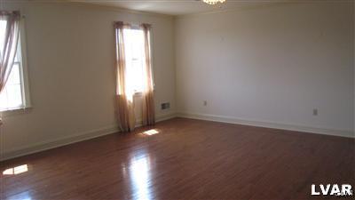 532 Roberts Road Nazareth, PA 18064 - Photo 32 of 34 an empty room with wooden floor and windows