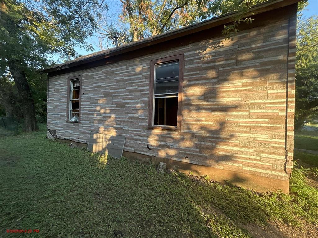 915 Turner Street Waco, TX 76704 - Photo 3 of 12 a front view of a house with a yard