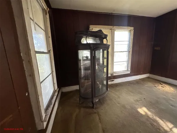 an empty room with closet and a bathroom