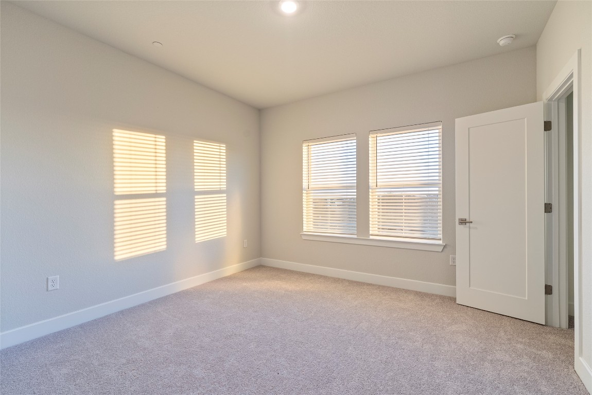 1057 Brickell Loop Austin, TX 78744 - Photo 10 of 33 a view of an empty room with a window