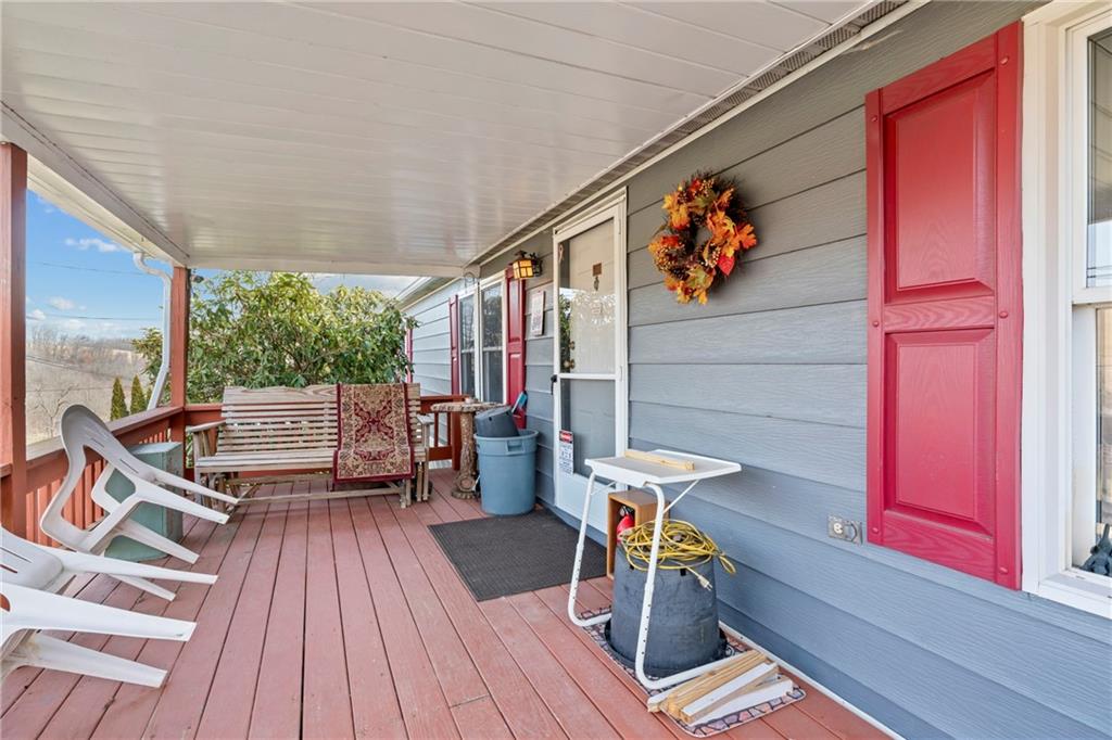 373 Taffy Run Road Rochester, PA 15074 - Photo 14 of 14 a view of balcony with chairs and wooden floor