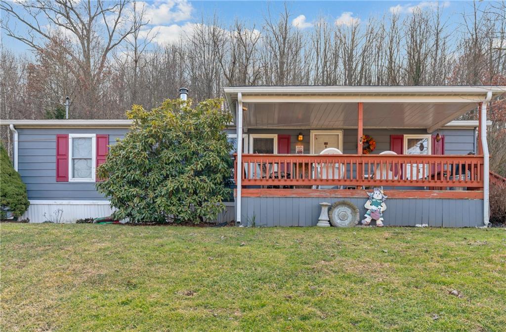 373 Taffy Run Road Rochester, PA 15074 - Photo 5 of 14 a front view of a house with garden