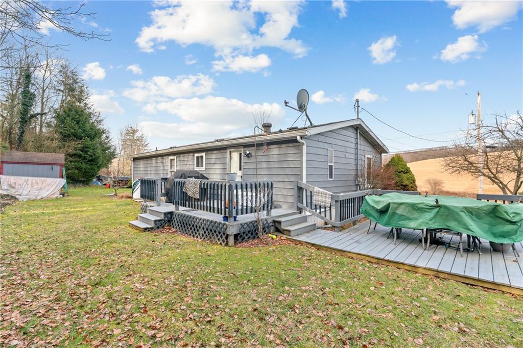 373 Taffy Run Road Rochester, PA 15074 - Photo 8 of 14 a view of a house with backyard and sitting area