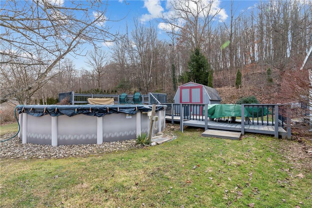 373 Taffy Run Road Rochester, PA 15074 - Photo 9 of 14 a view of swimming pool with outdoor seating and a garden