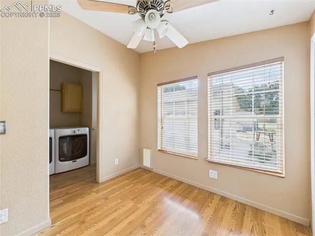 an empty room with windows and closet