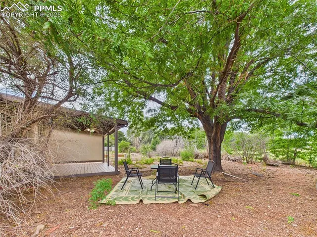 a view of swimming pool with a patio