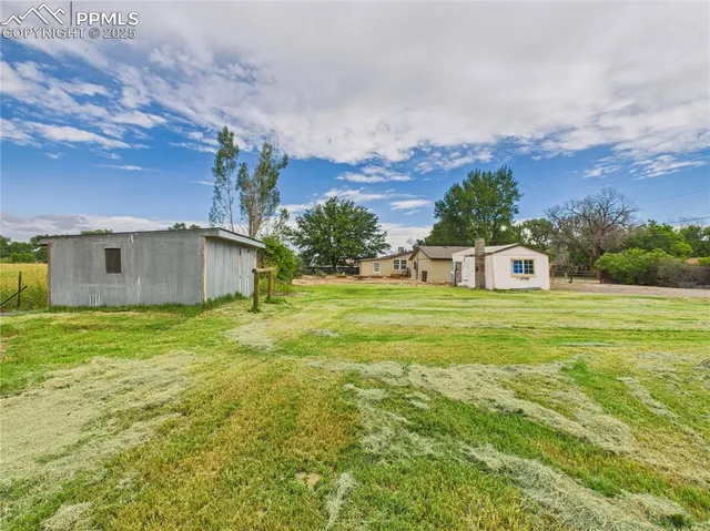 a view of a big yard with a house