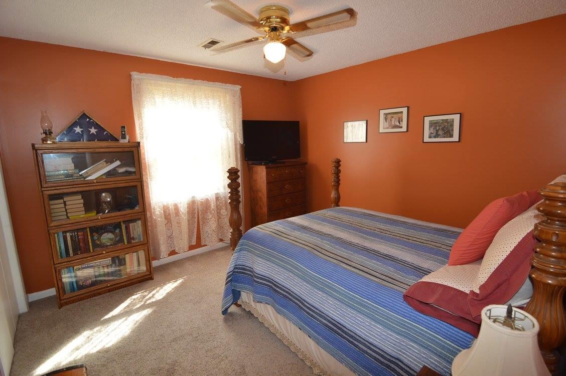 101 Bettis Road Lebanon, TN 37090 - Photo 15 of 20 a bedroom with bed and a chandelier