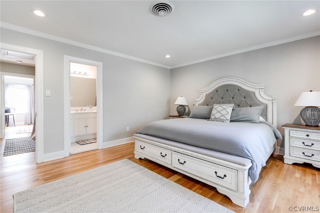 300 North Ridge Road, Unit 3 Richmond, VA 23229 - Photo 13 of 20 a bedroom with a bed and wooden floor
