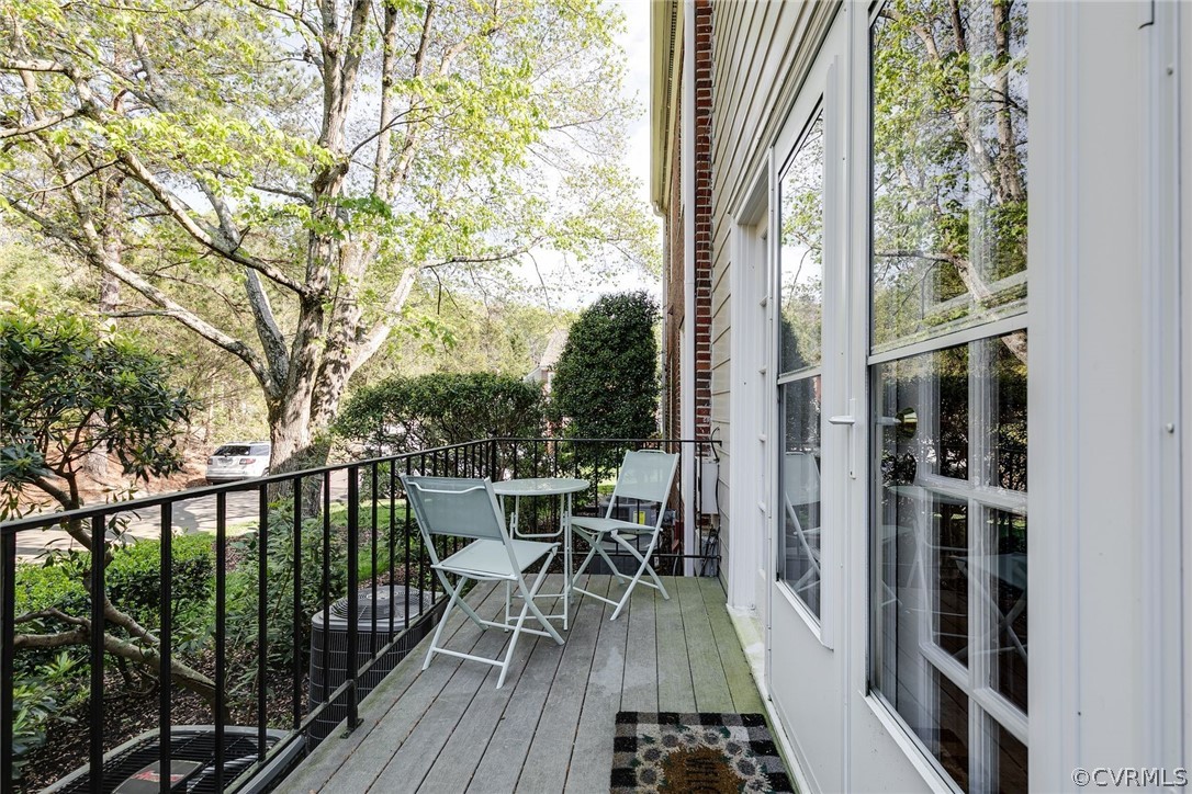 300 North Ridge Road, Unit 3 Richmond, VA 23229 - Photo 20 of 20 a view of a balcony with chairs and wooden floor