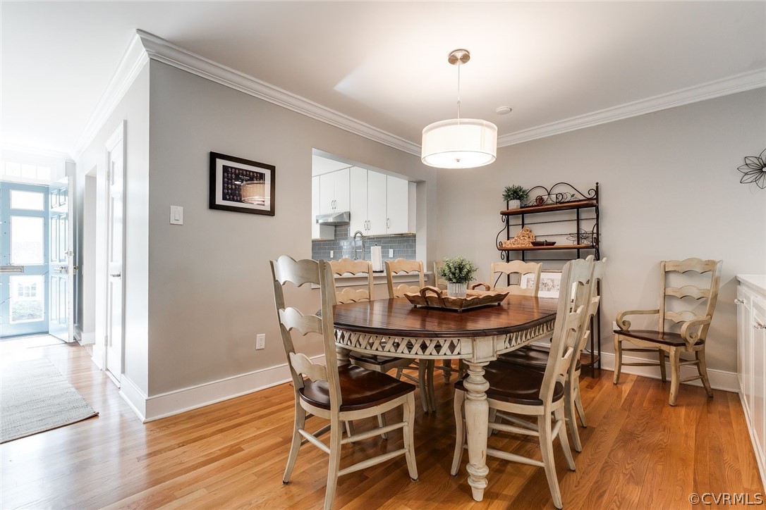 300 North Ridge Road, Unit 3 Richmond, VA 23229 - Photo 7 of 20 a view of a dining room with furniture wooden floor and chandelier