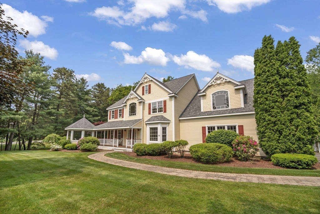 32 Bulkley Road Sudbury, MA 01776 - Photo 1 of 39 a front view of a house with a yard