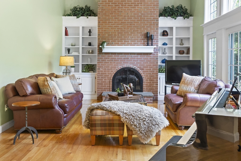 32 Bulkley Road Sudbury, MA 01776 - Photo 12 of 39 a living room with furniture and a fireplace