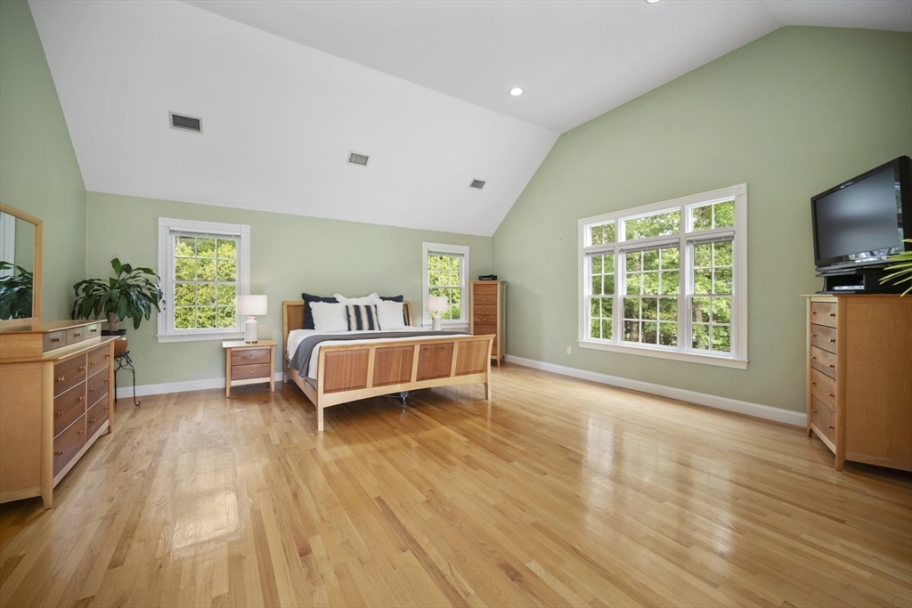 32 Bulkley Road Sudbury, MA 01776 - Photo 20 of 39 a bed room with a bed and a chair