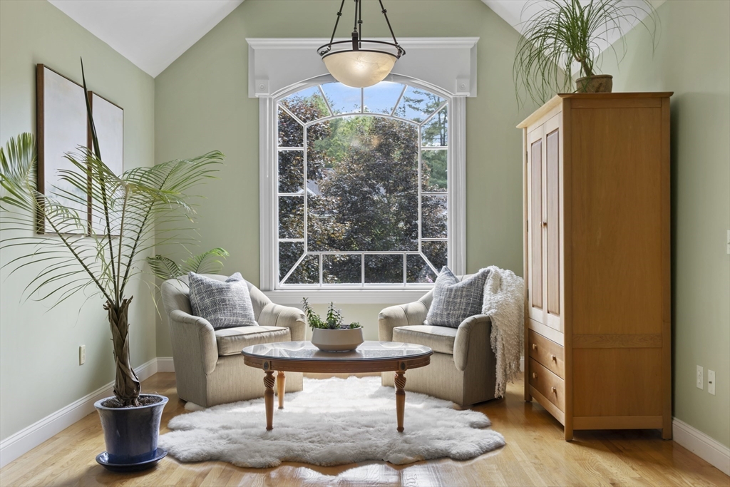32 Bulkley Road Sudbury, MA 01776 - Photo 21 of 39 a living room with furniture and a chandelier