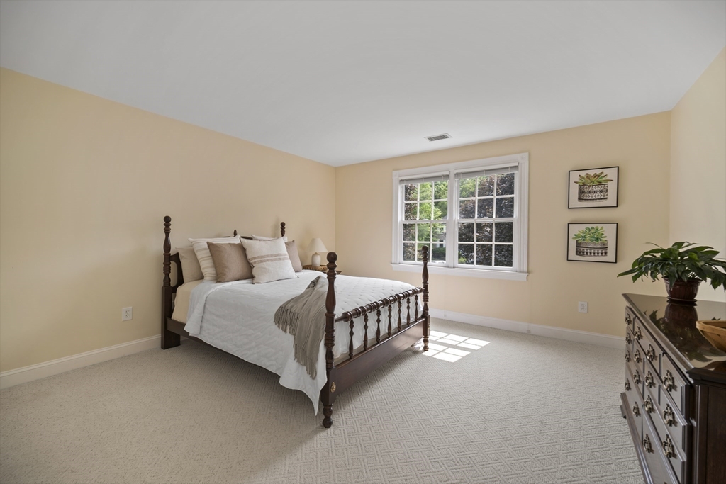32 Bulkley Road Sudbury, MA 01776 - Photo 28 of 39 a bedroom with a bed and windows