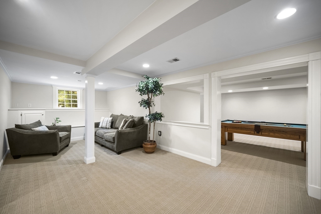 32 Bulkley Road Sudbury, MA 01776 - Photo 32 of 39 a living room with furniture and a potted plant