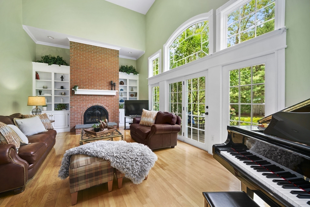 32 Bulkley Road Sudbury, MA 01776 - Photo 8 of 39 a living room with furniture and a fireplace