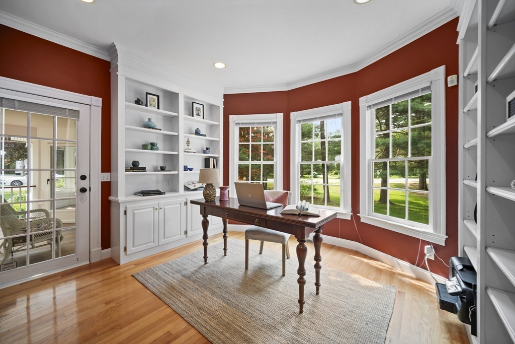 32 Bulkley Road Sudbury, MA 01776 - Photo 9 of 39 a living room with furniture a large window and wooden floor