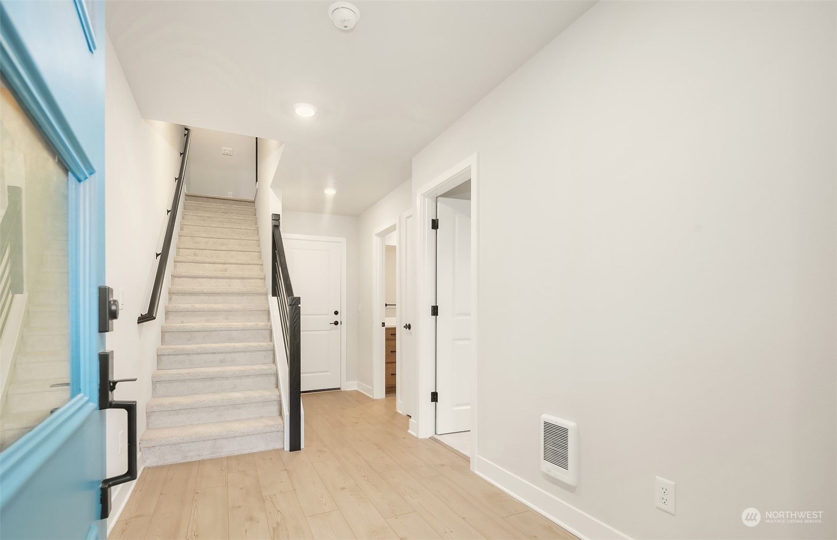 9013 Northeast 203rd Place, Unit B Bothell, WA 98021 - Photo 2 of 16 a view of a hallway with staircase