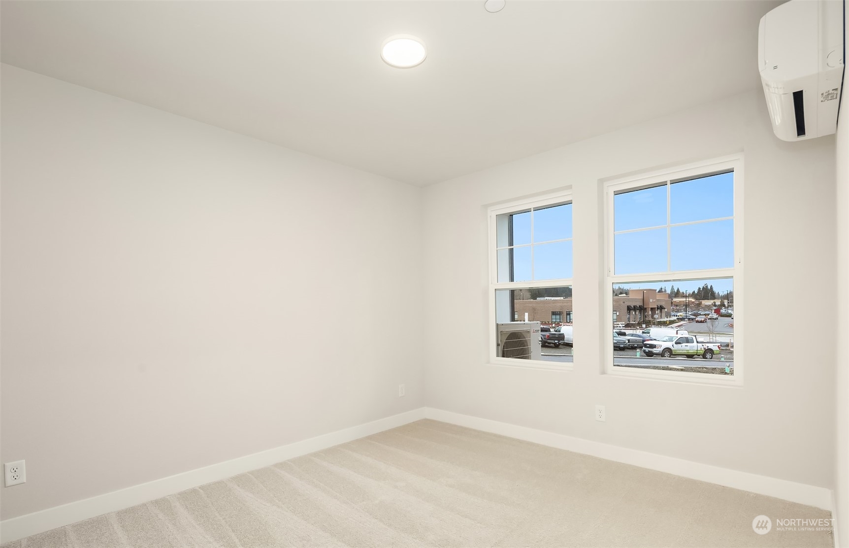 9013 Northeast 203rd Place, Unit B Bothell, WA 98021 - Photo 3 of 16 an empty room with windows