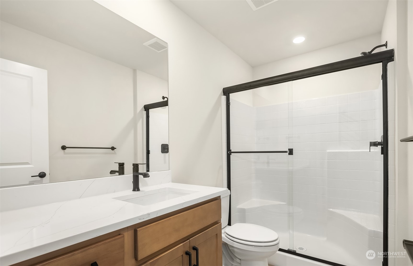 9013 Northeast 203rd Place, Unit B Bothell, WA 98021 - Photo 4 of 16 a bathroom with a sink and a mirror