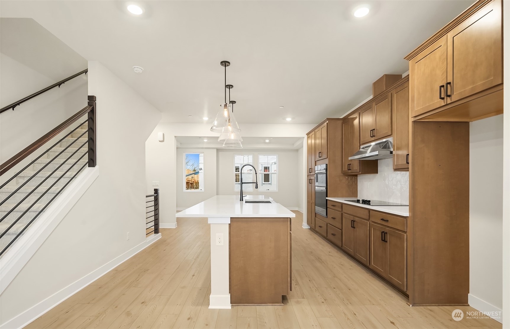 9013 Northeast 203rd Place, Unit B Bothell, WA 98021 - Photo 8 of 16 a large kitchen with stainless steel appliances granite countertop a refrigerator and a sink