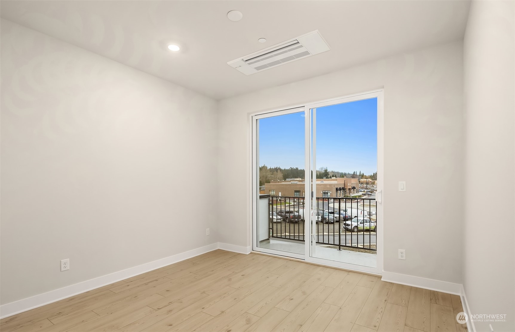 9013 Northeast 203rd Place, Unit B Bothell, WA 98021 - Photo 9 of 16 a view of an empty room with a window
