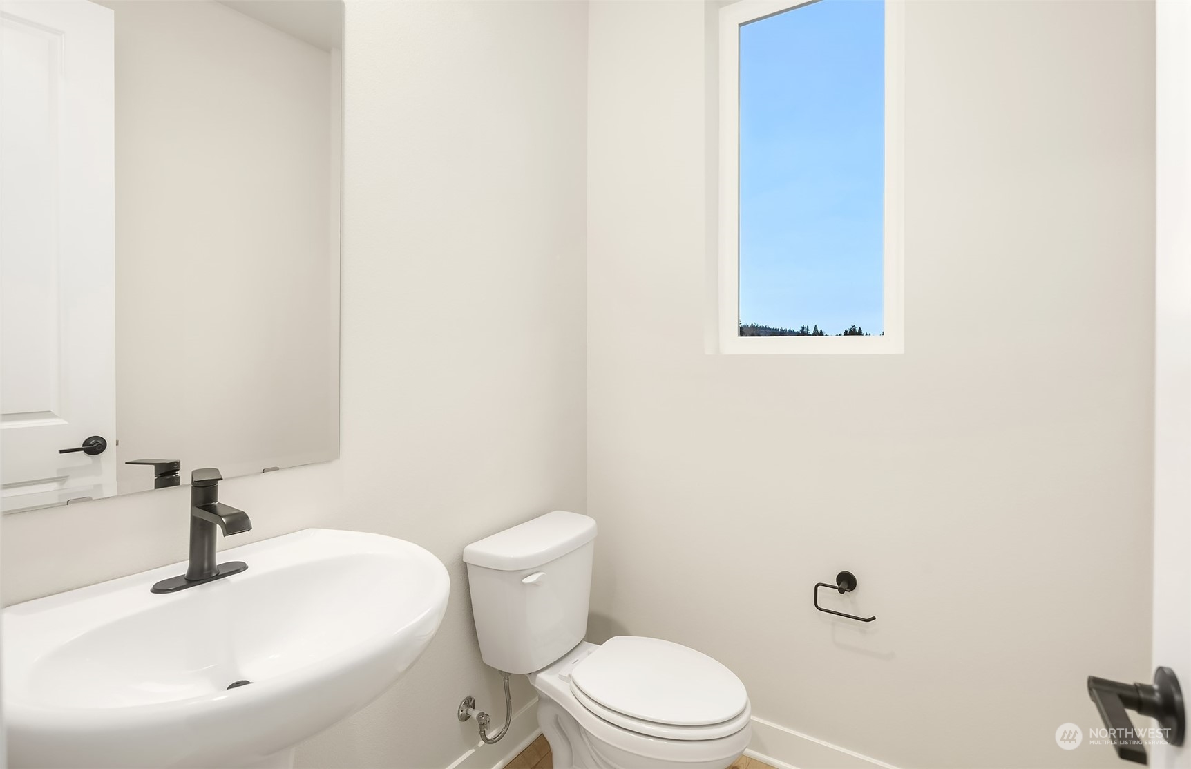 9013 Northeast 203rd Place, Unit B Bothell, WA 98021 - Photo 10 of 16 a bathroom with a sink and a toilet