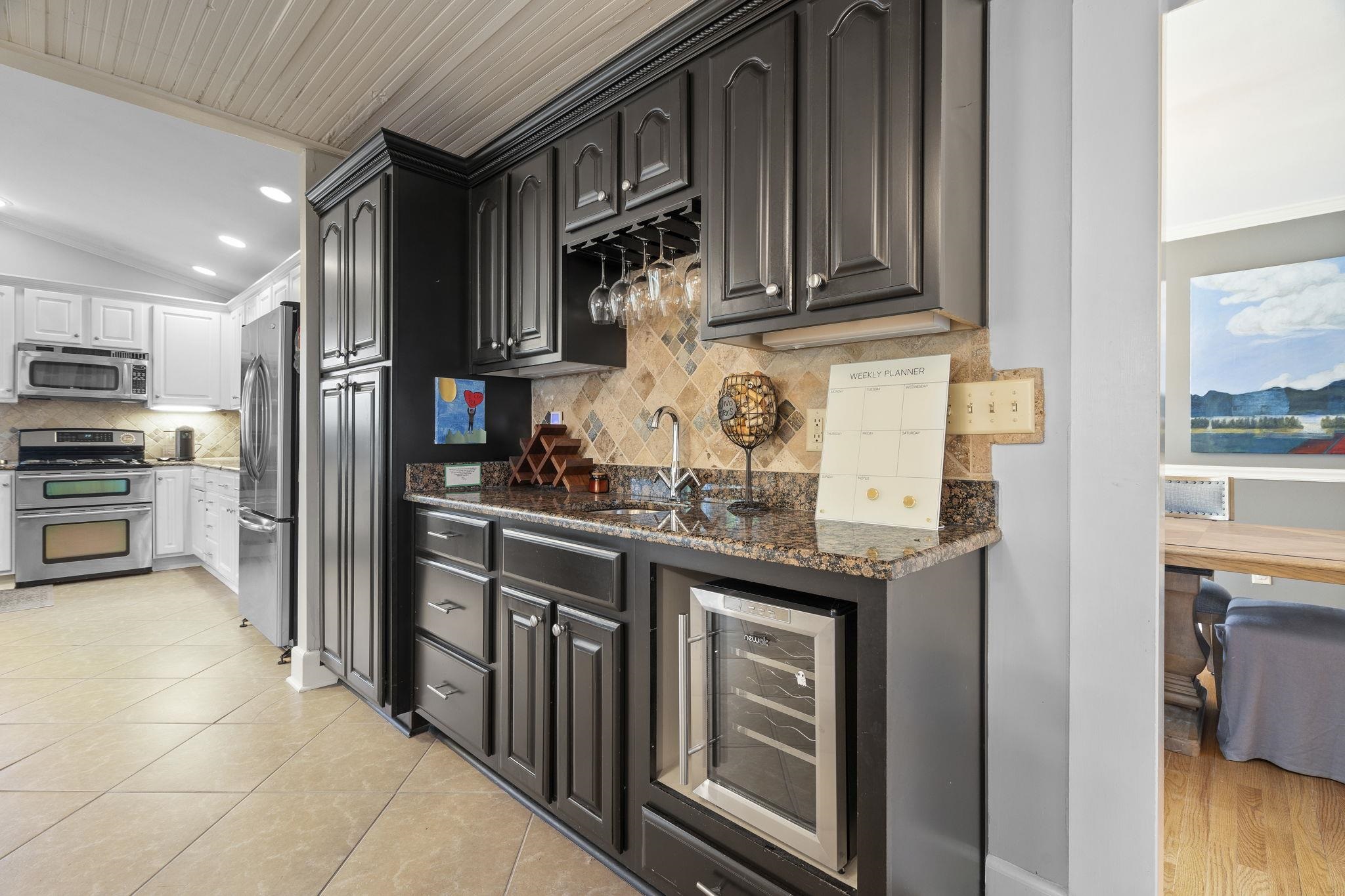 549 Peterson Lake Road Collierville, TN 38017 - Photo 11 of 34 a kitchen with stainless steel appliances granite countertop a refrigerator and a sink