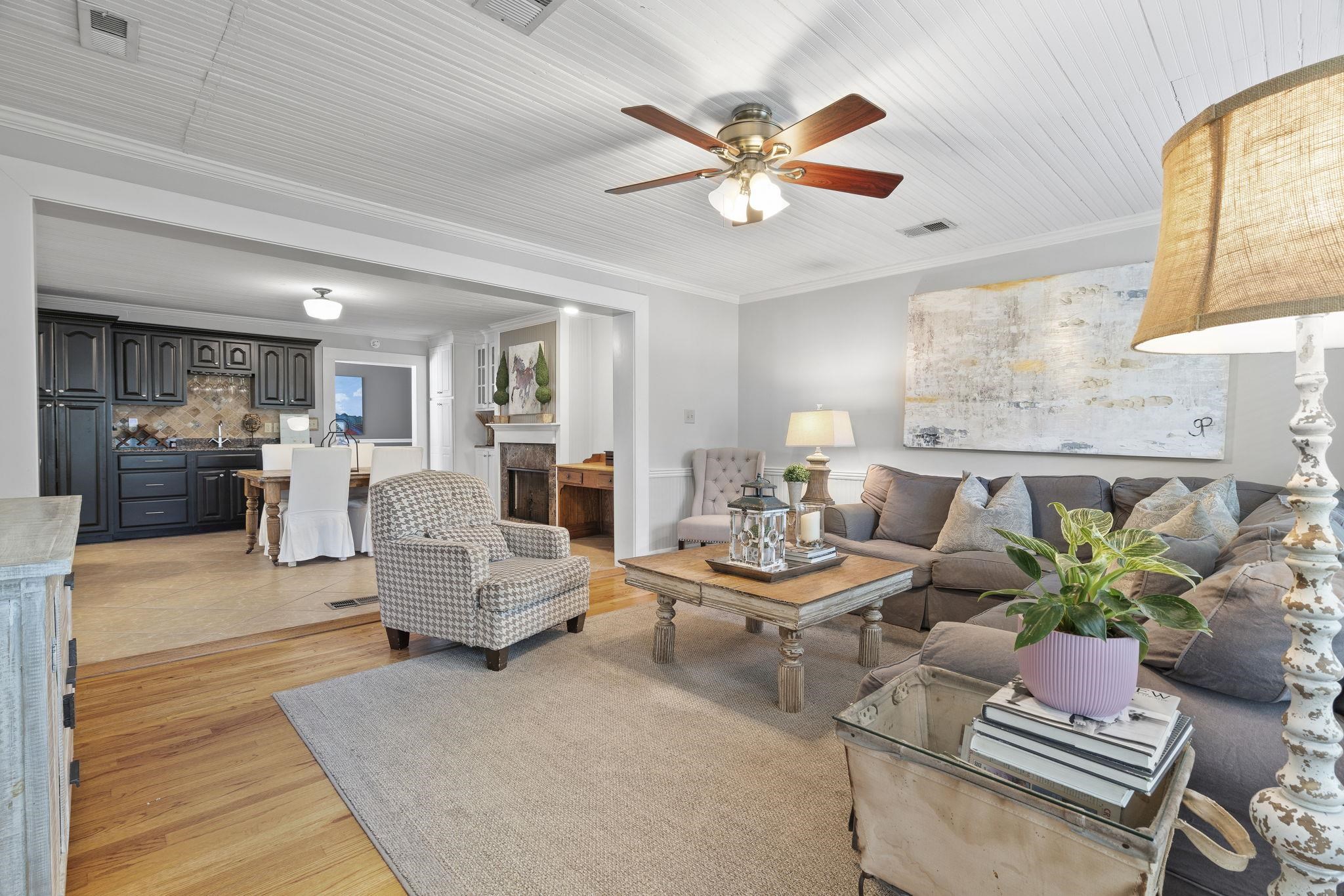 549 Peterson Lake Road Collierville, TN 38017 - Photo 13 of 34 a living room with furniture kitchen view and a chandelier