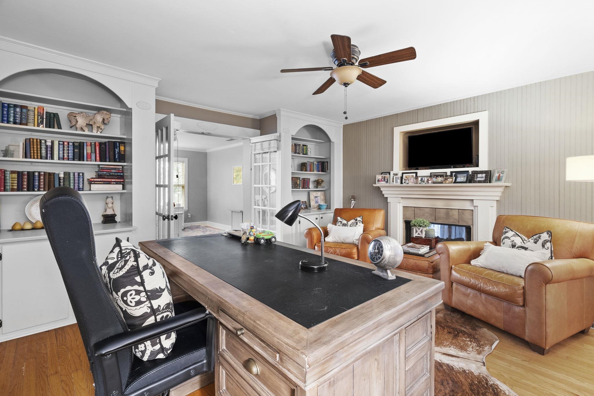 549 Peterson Lake Road Collierville, TN 38017 - Photo 14 of 34 a living room with furniture a flat screen tv and a fireplace