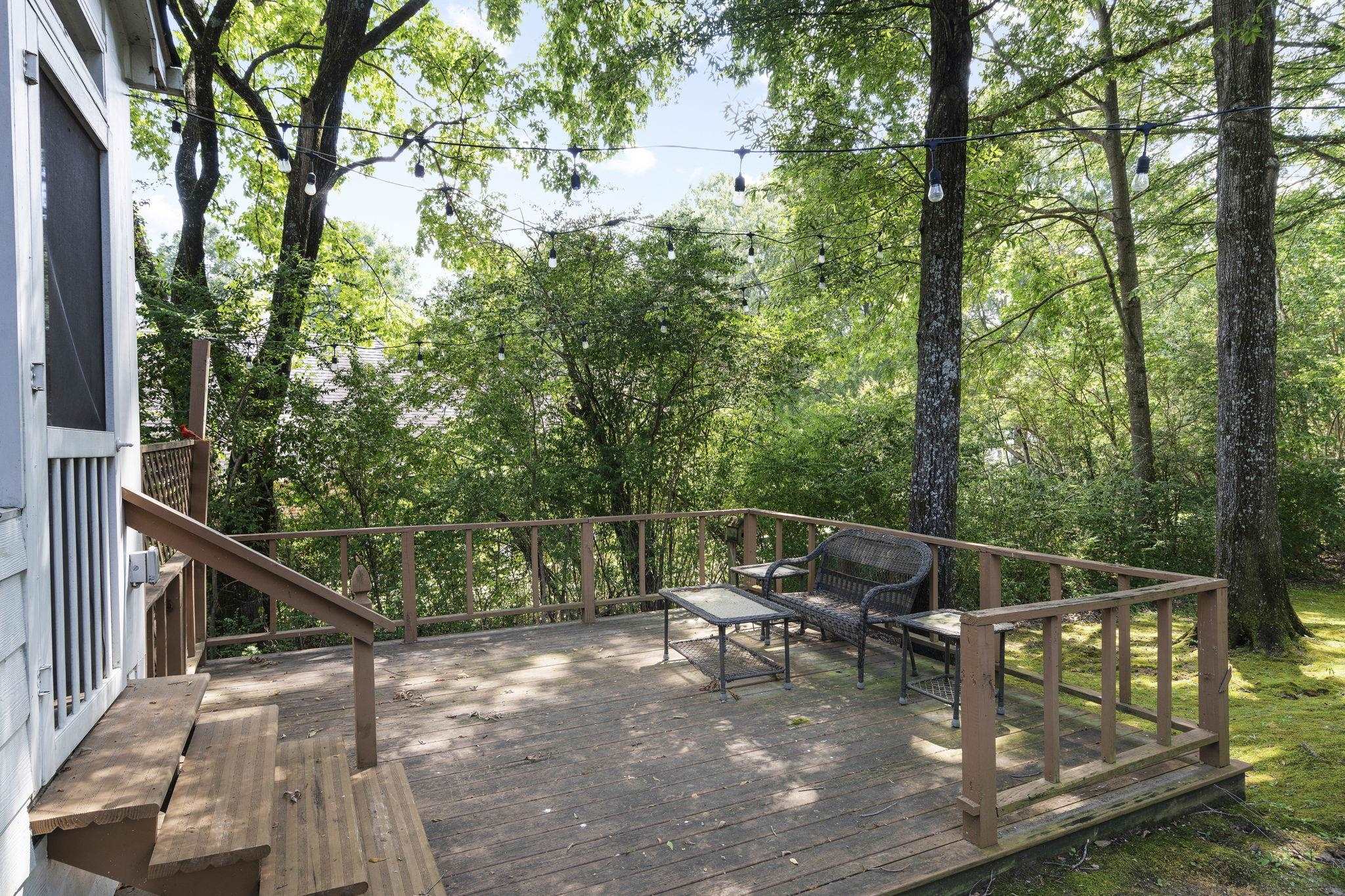 549 Peterson Lake Road Collierville, TN 38017 - Photo 24 of 34 a roof deck with chairs and wooden fence