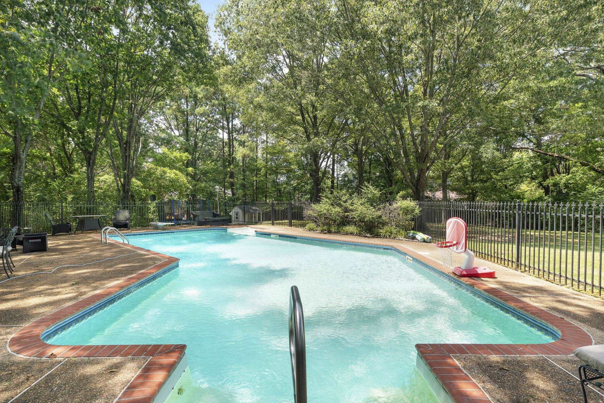 549 Peterson Lake Road Collierville, TN 38017 - Photo 27 of 34 a view of a backyard with swimming pool