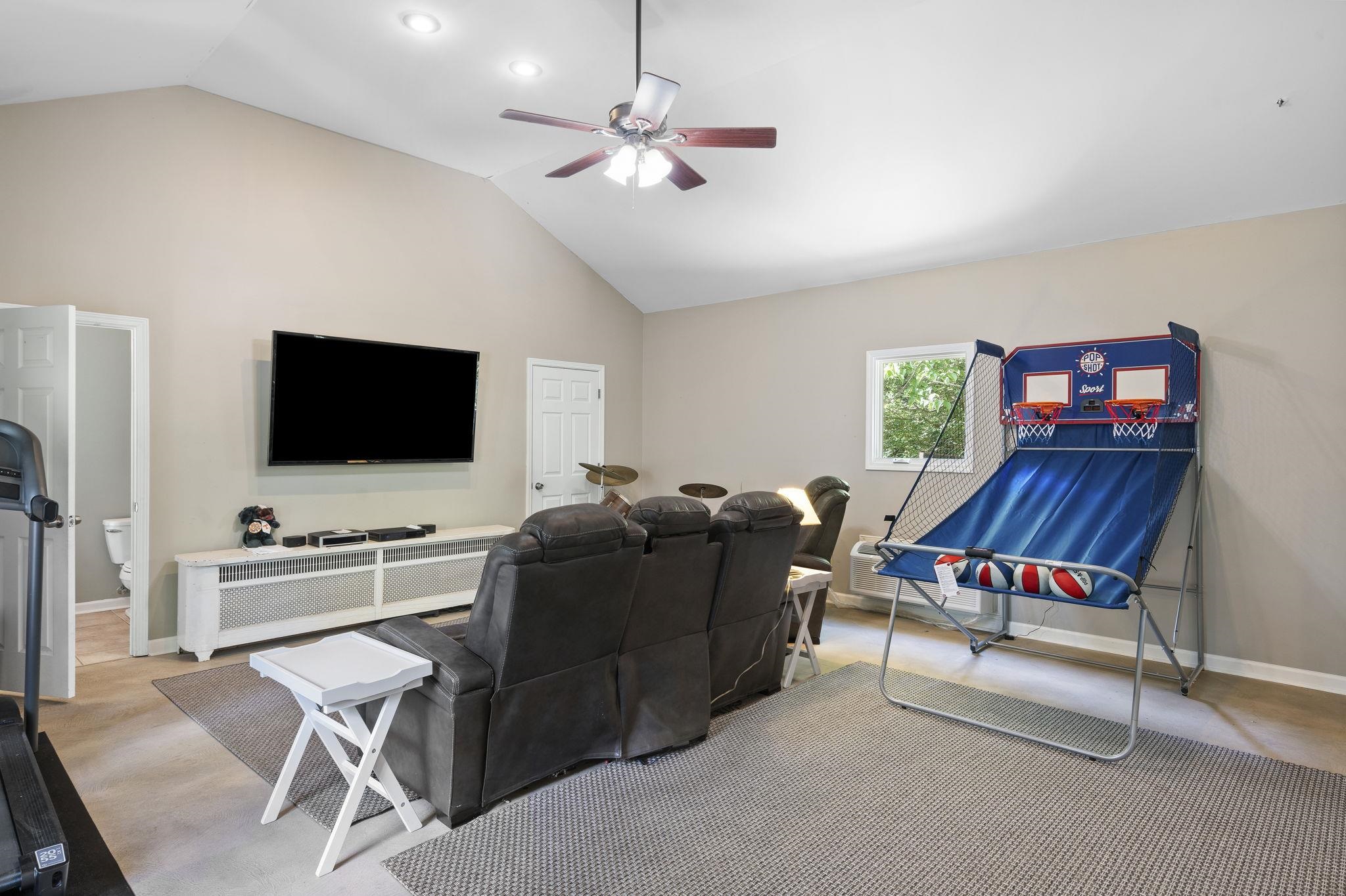 549 Peterson Lake Road Collierville, TN 38017 - Photo 29 of 34 a living room with furniture and a flat screen tv