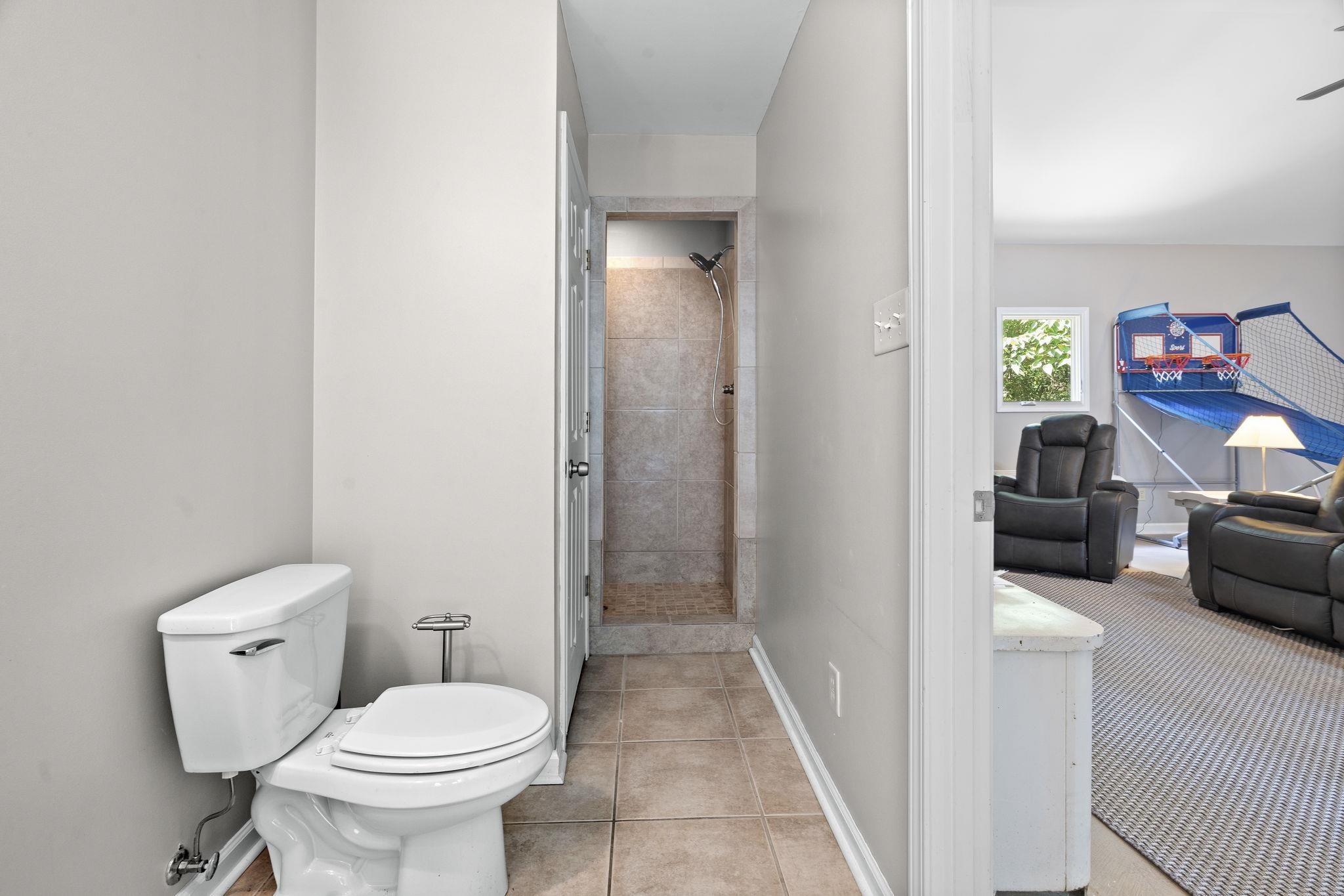 549 Peterson Lake Road Collierville, TN 38017 - Photo 30 of 34 a bathroom with a toilet and a view of bathroom