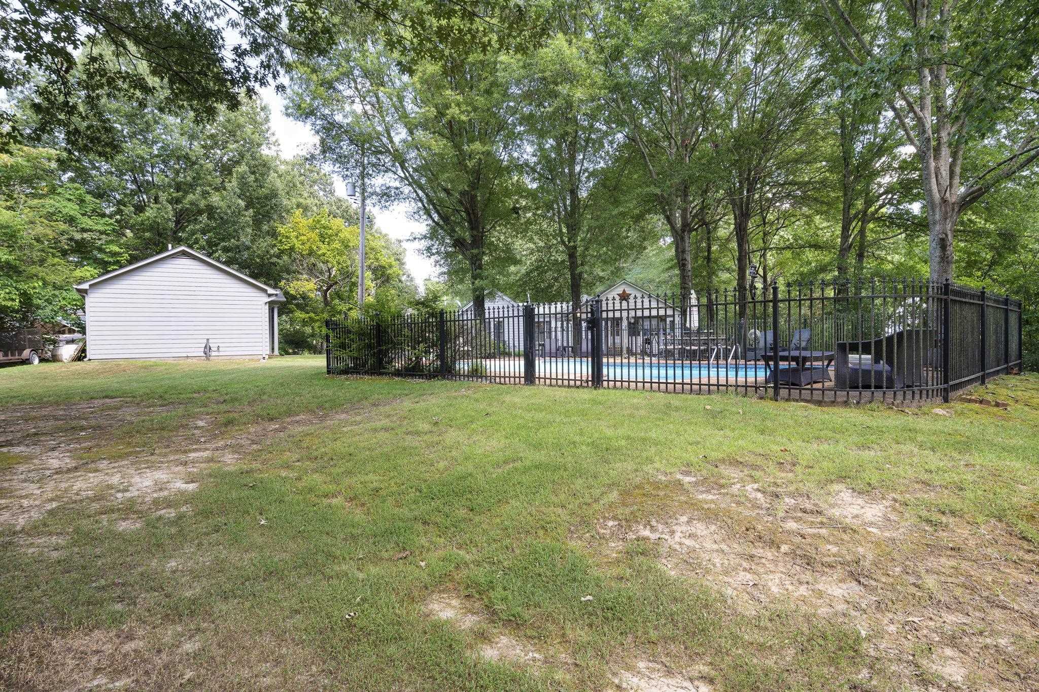 549 Peterson Lake Road Collierville, TN 38017 - Photo 31 of 34 a view of house with backyard and a slide