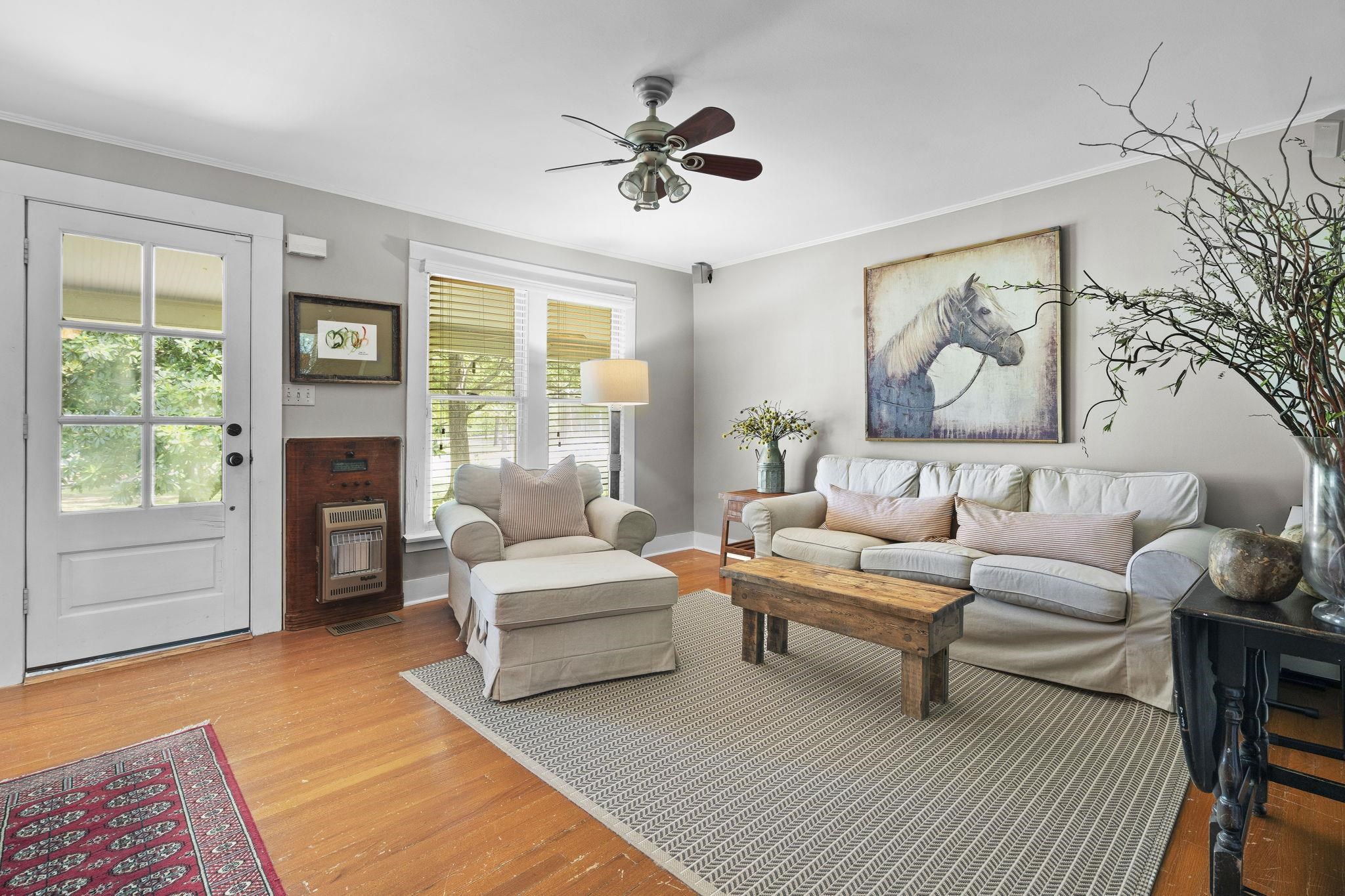 549 Peterson Lake Road Collierville, TN 38017 - Photo 4 of 34 a living room with furniture a fireplace and a table