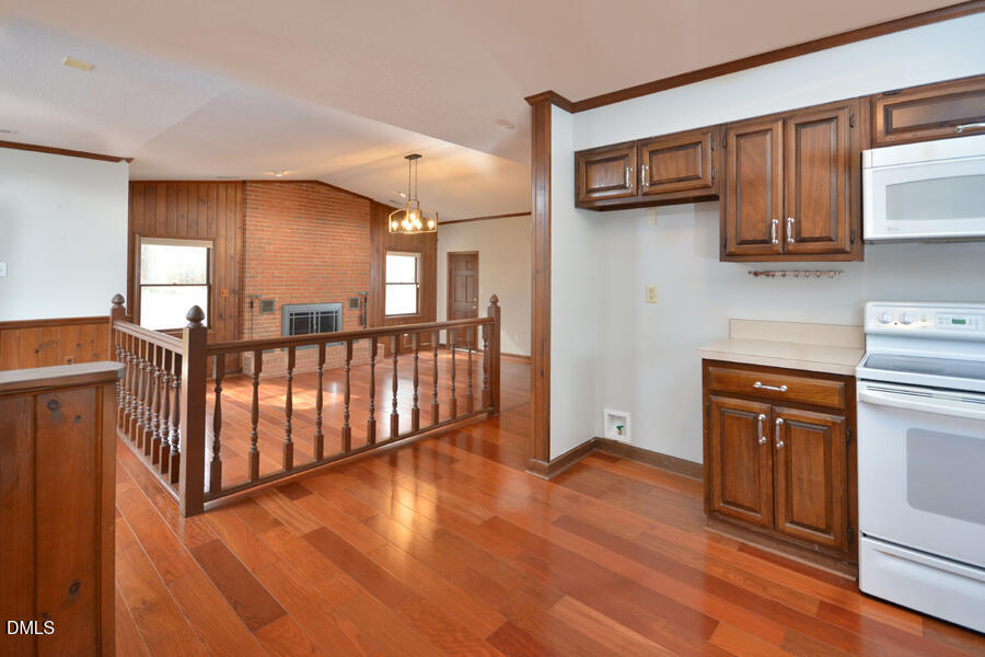 401 Martindale Drive Raleigh, NC 27614 - Photo 11 of 35 a view of a kitchen with wooden floor and electronic appliances