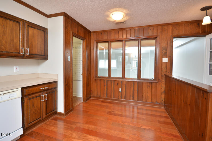 401 Martindale Drive Raleigh, NC 27614 - Photo 14 of 35 a view of an empty room with window and wooden floor