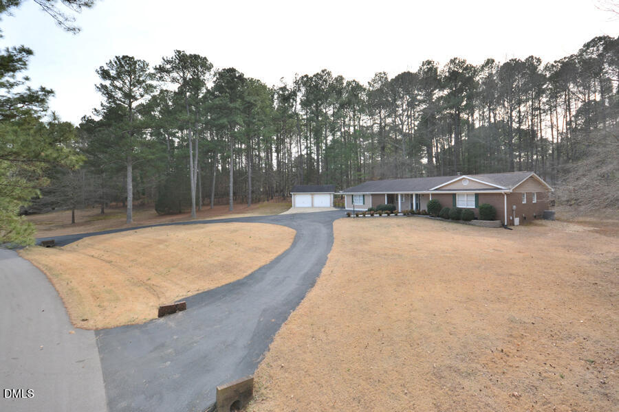 401 Martindale Drive Raleigh, NC 27614 - Photo 3 of 35 a swimming pool with outdoor seating and yard