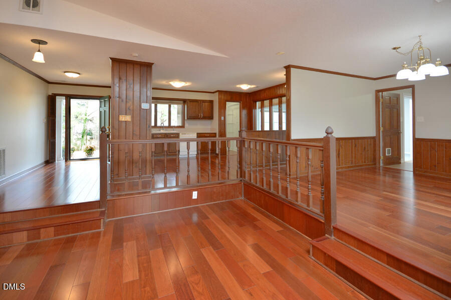 401 Martindale Drive Raleigh, NC 27614 - Photo 9 of 35 a view of an entryway with wooden floor