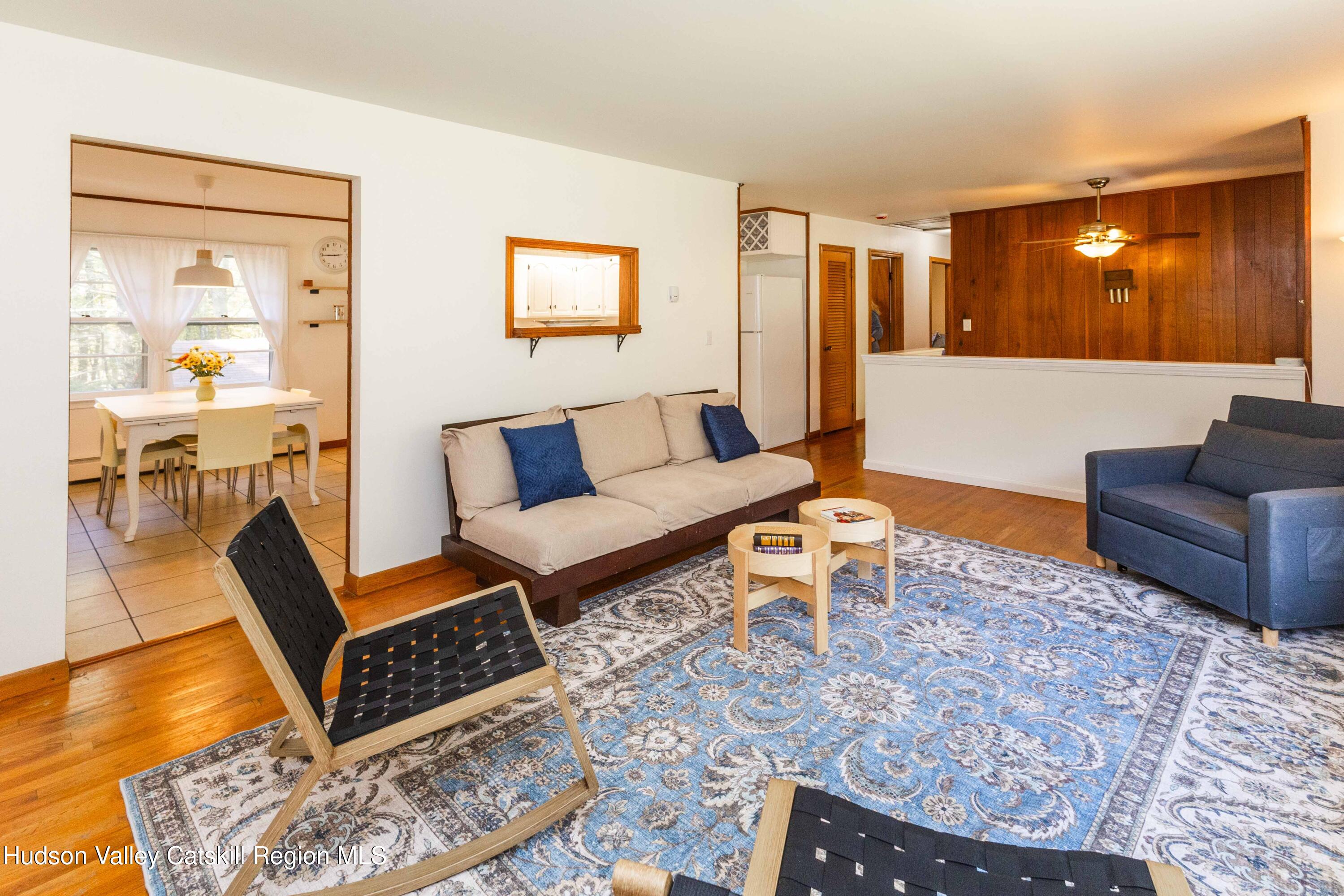 94 Lodge Road Saugerties, NY 12477 - Photo 12 of 47 a living room with furniture and a table