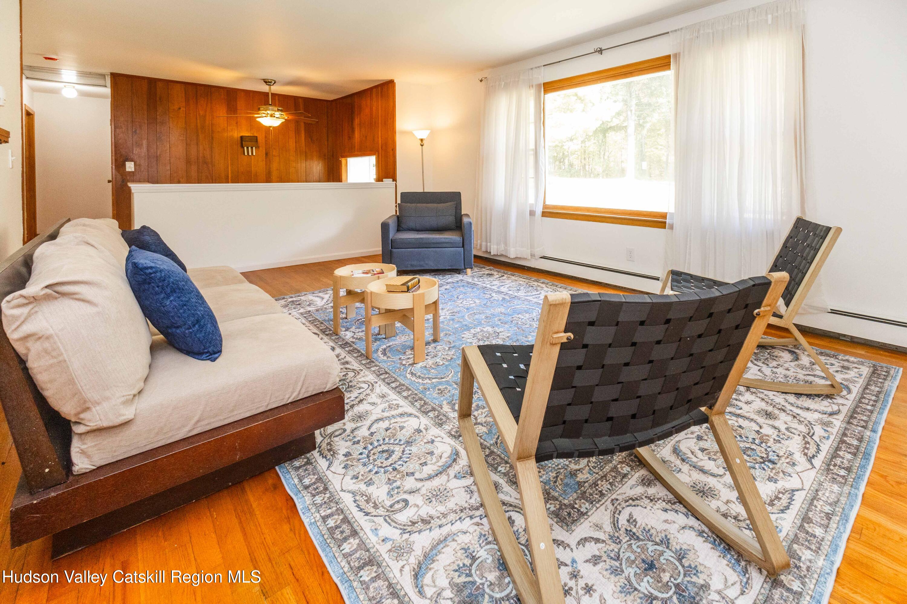 94 Lodge Road Saugerties, NY 12477 - Photo 13 of 46 a living room with furniture and a table