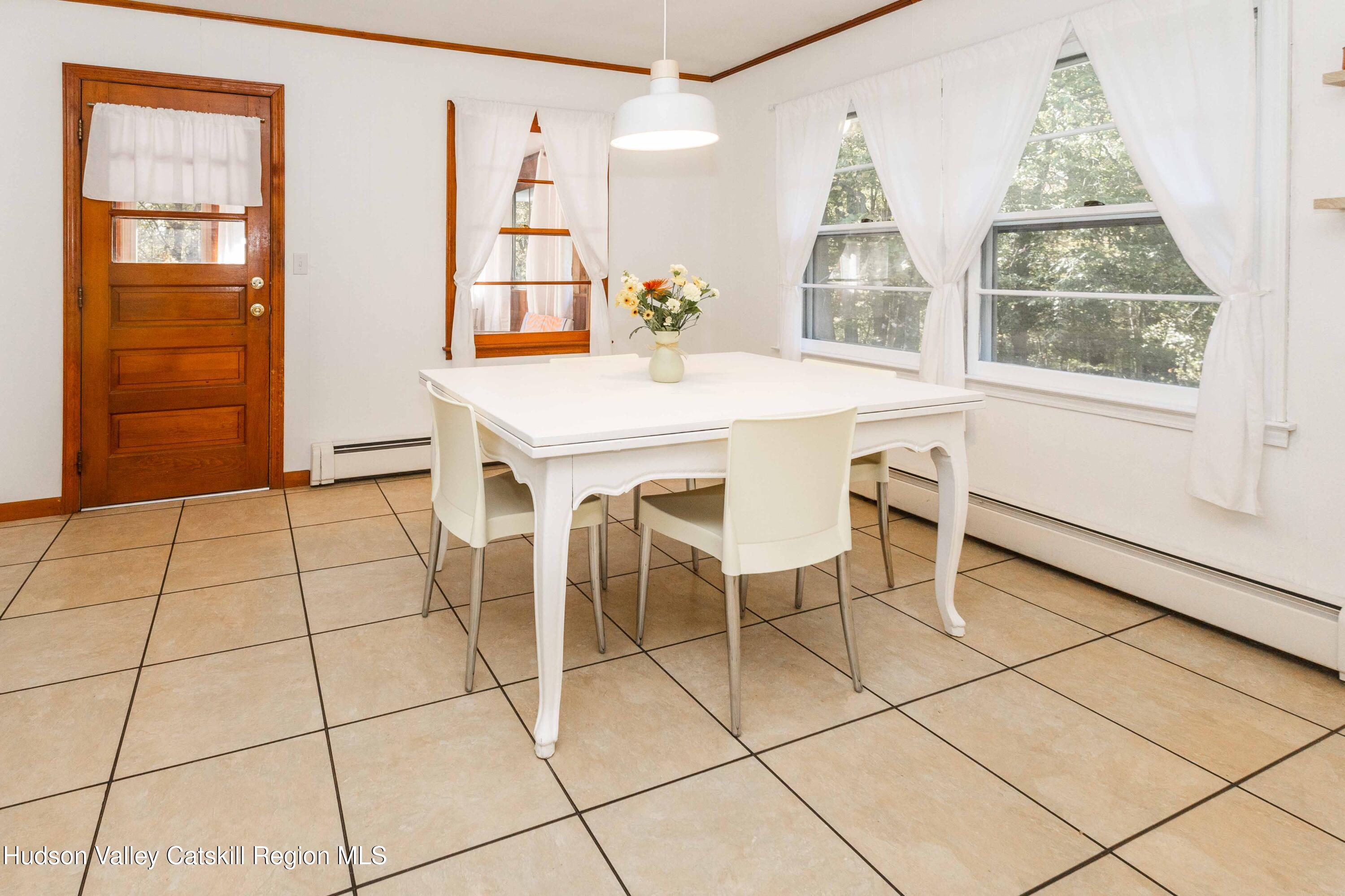 94 Lodge Road Saugerties, NY 12477 - Photo 20 of 47 a view of a dining room with furniture and a window