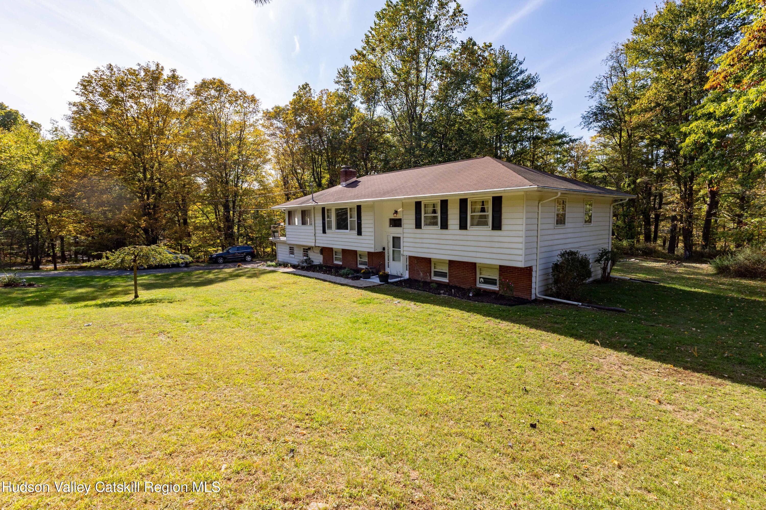 94 Lodge Road Saugerties, NY 12477 - Photo 2 of 47 a view of a house with swimming pool and yard